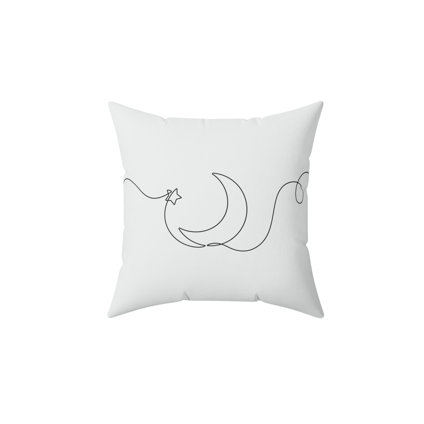 White pillow with black crescent moon and star design 