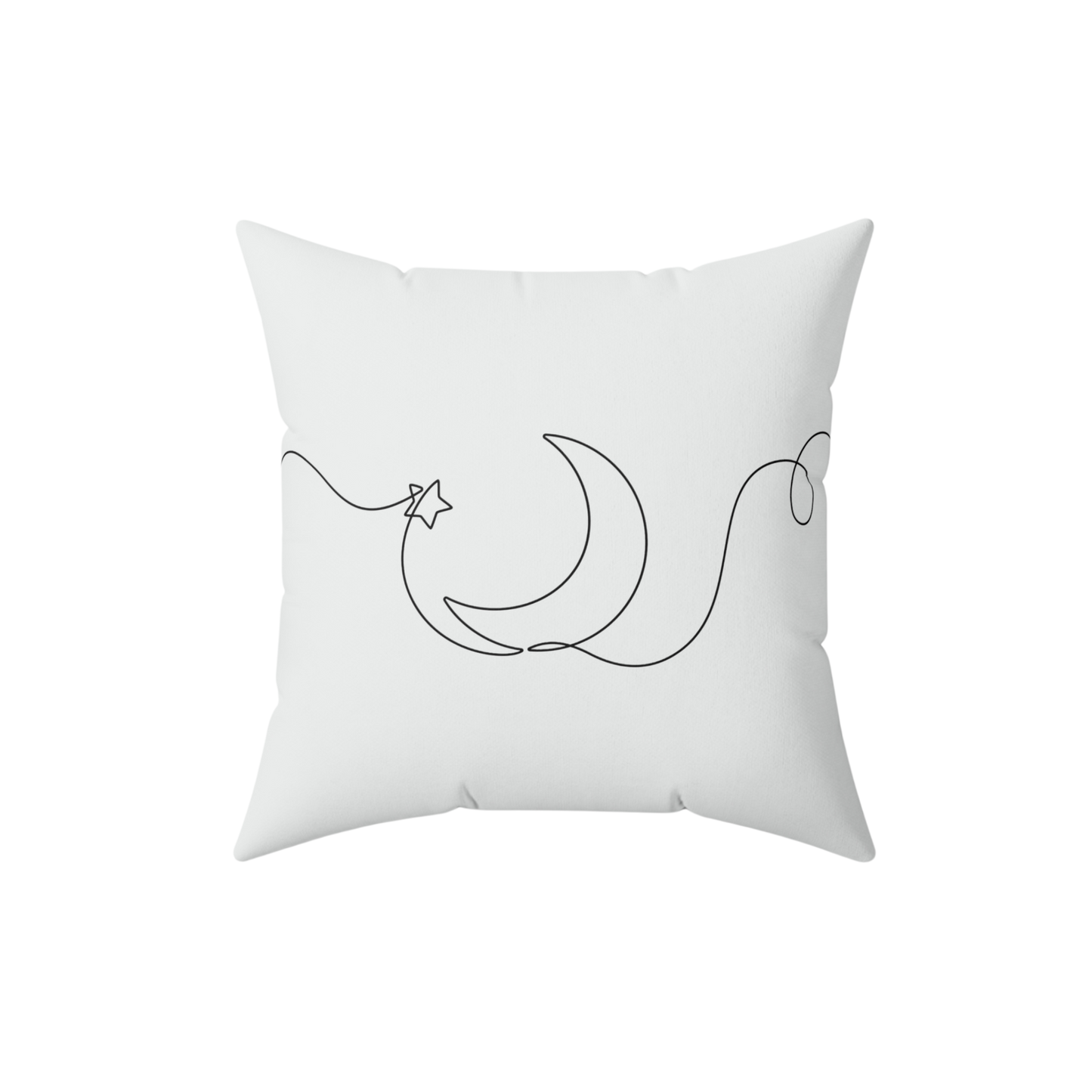 White pillow with black crescent moon and star design