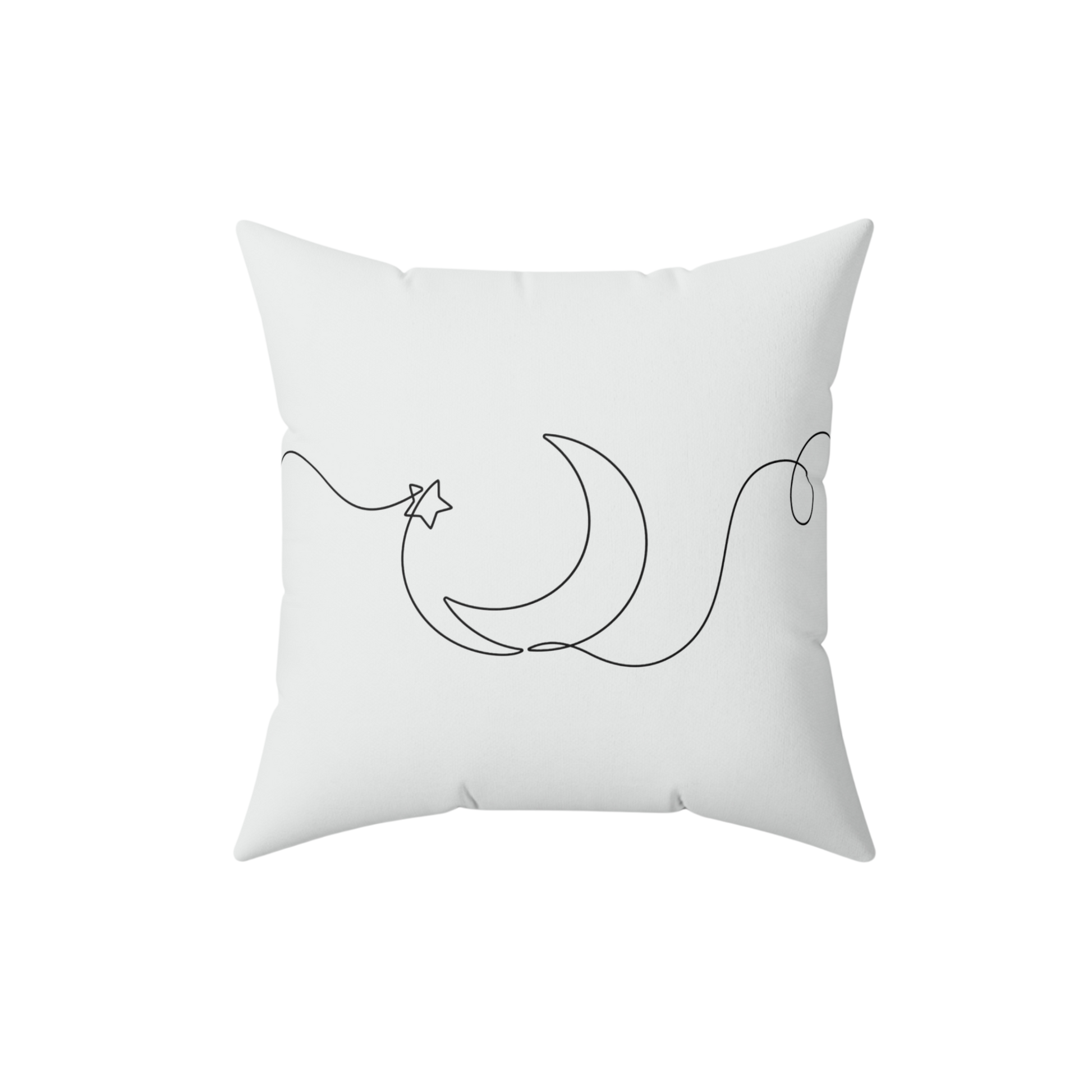 White pillow with black crescent moon and star design