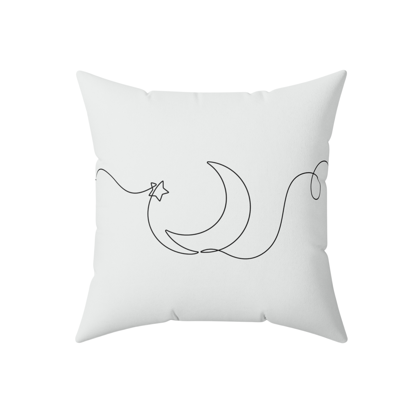 White pillow with black crescent moon and star design 