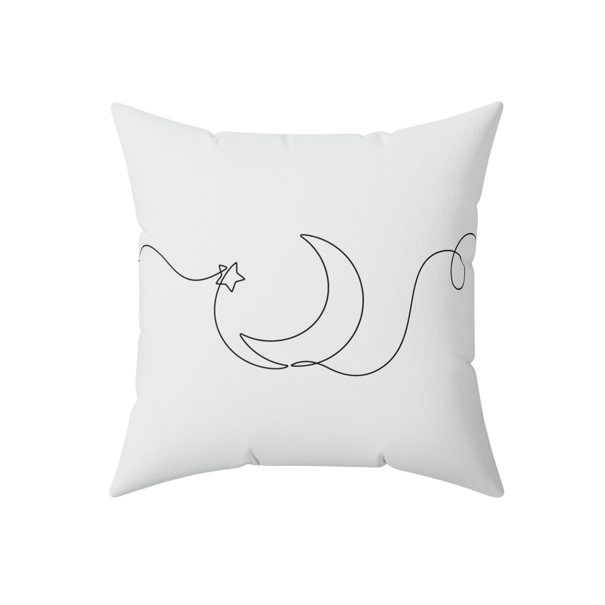 White pillow with black crescent moon and star design 