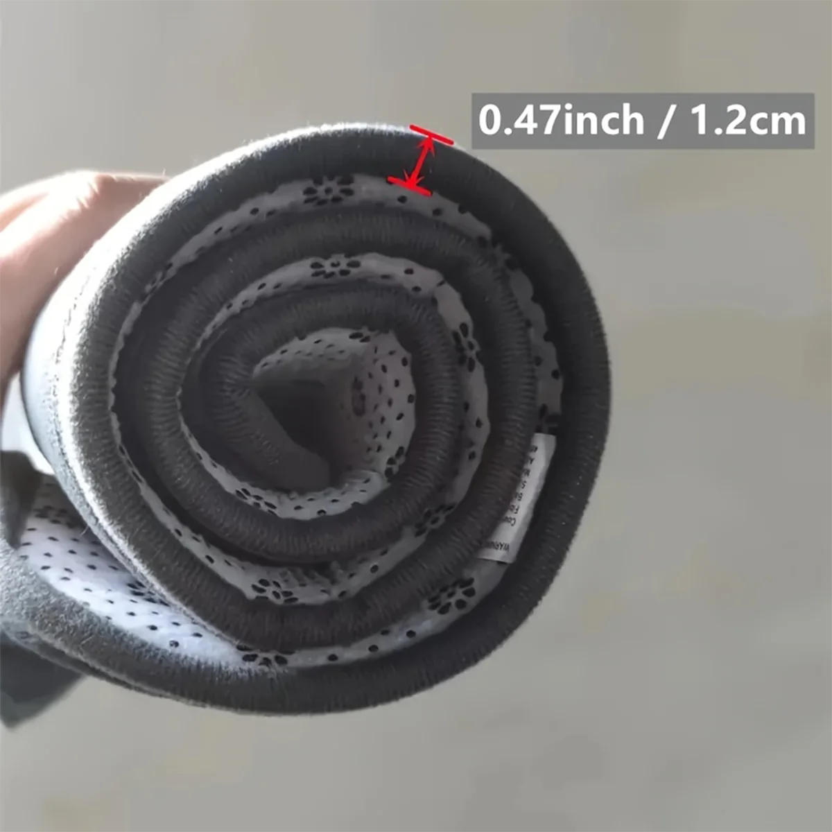 Rolled up prayer mat showing the thickness of the mat