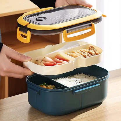 Person showing the two layers and lid of the Back-to-School lunch box