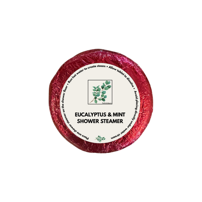 Eucalyptus and mint shower steamer wrapped in red paper with round product sticker