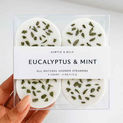 Hand holding box of 4 Eucalyptus & Mint Shower Steamers