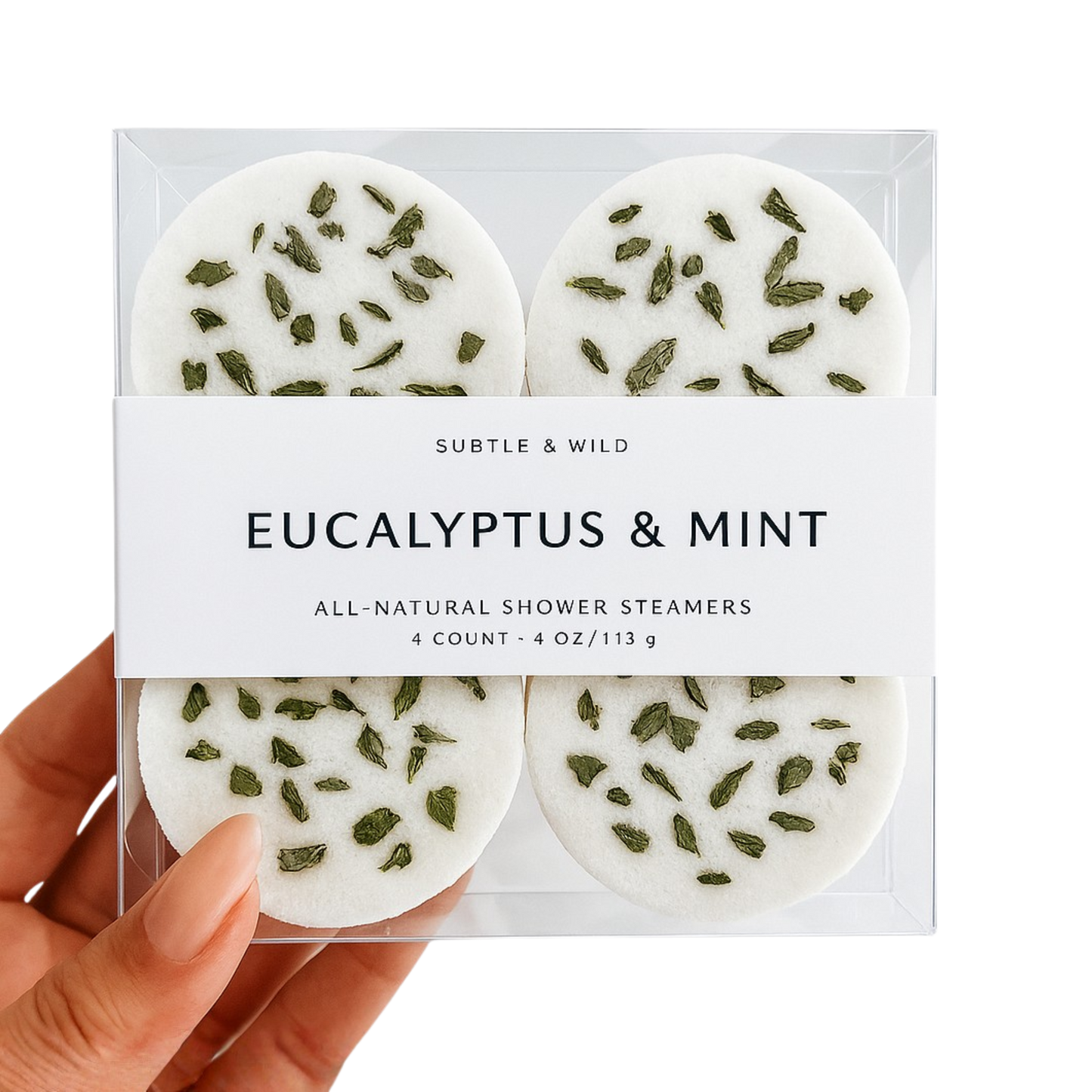 Pack of Eucalyptus & Mint shower steamers held by a hand with a clear background