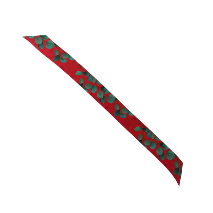 Red eucalyptus silk skinny scarf laid flat, showing full eucalyptus design
