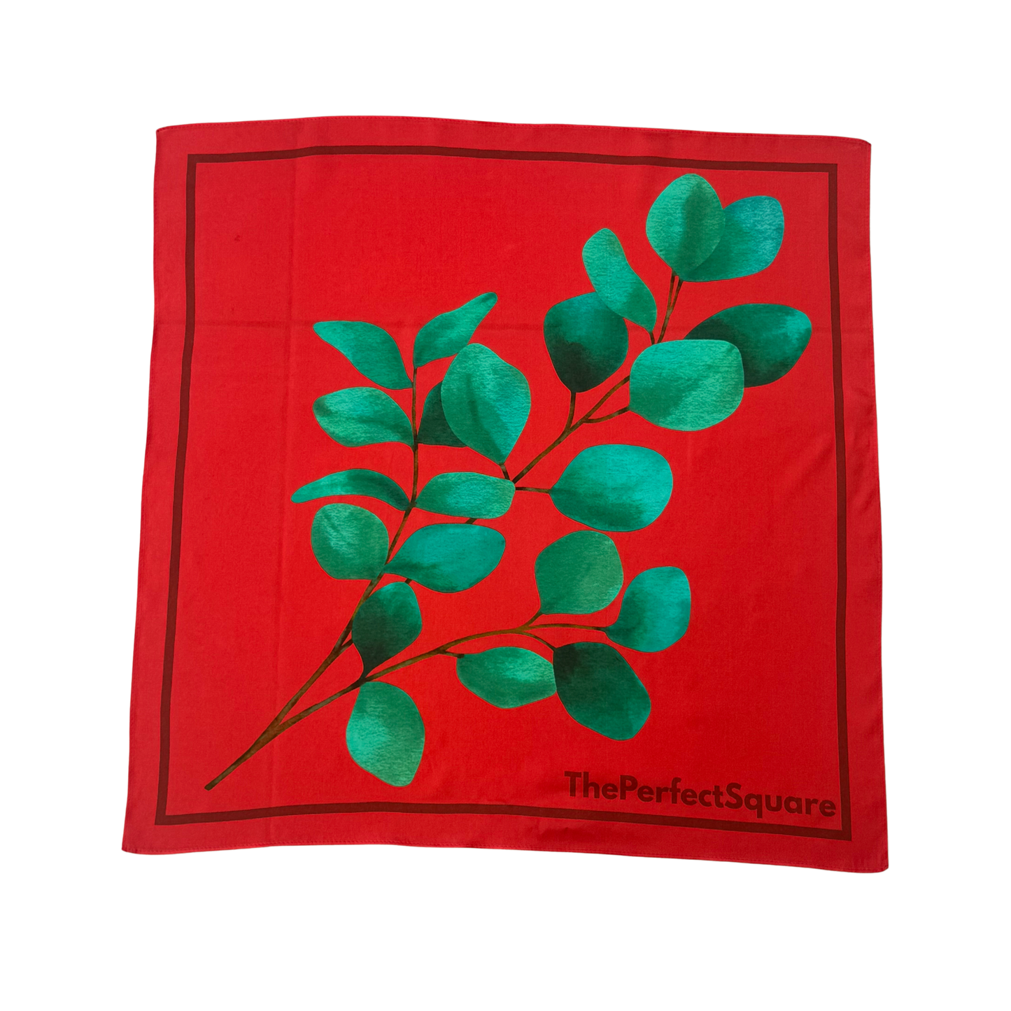 Front view of Eucalyptus silk square scarf with red base and green design