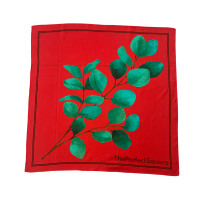 Front view of Eucalyptus silk square scarf with red base and green design
