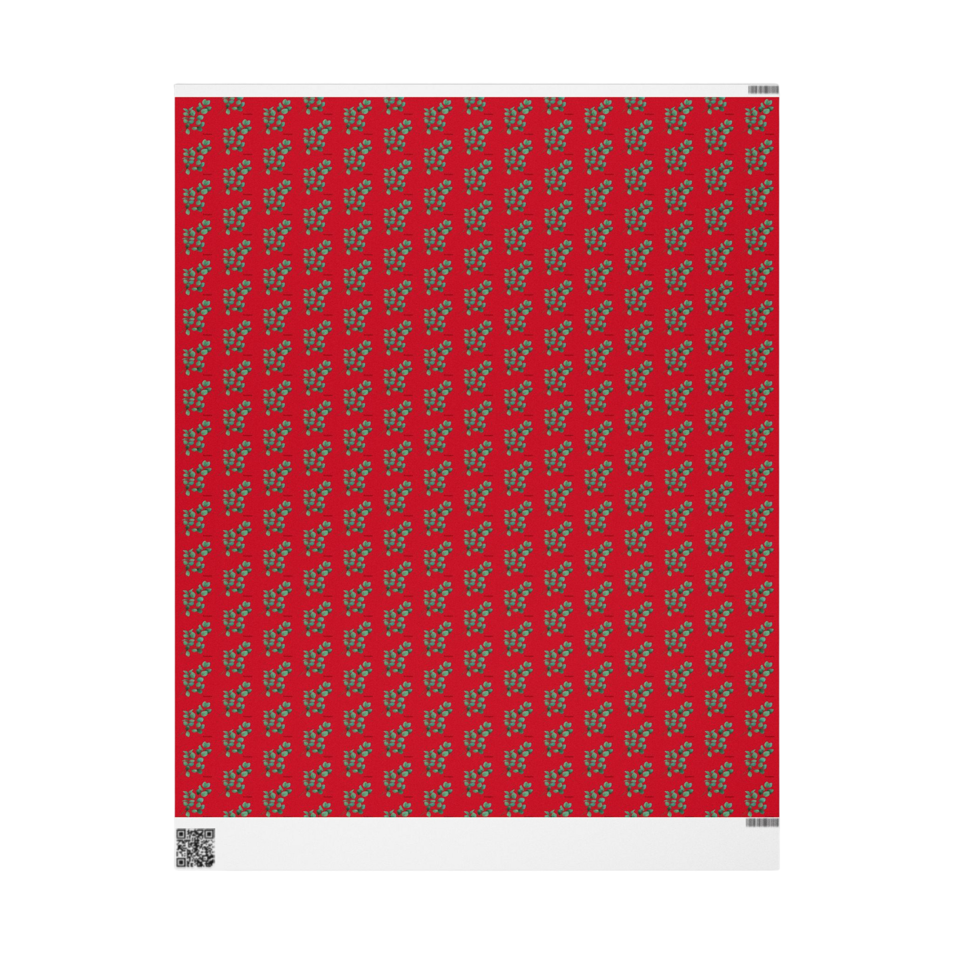 Flat sheet of matte eucalyptus wrapping paper with subtle green botanical pattern