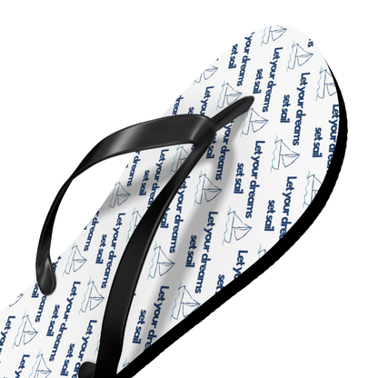 Close-up of cushioned flip flop with detailed coastal print and PVC strap
