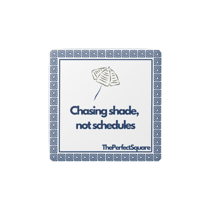 Porcelain tile magnet with quote “Chasing shade, not schedules” and umbrella sketch