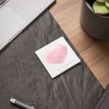 Heart gem Post-it pad on desk beside laptop and pen